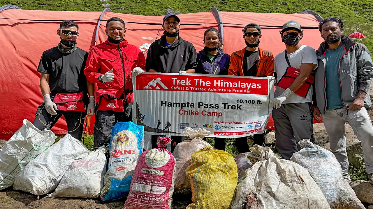 Trek The Himalayas at Chika Camp, Hampta Pass Trek, promoting environmental conservation through waste collection by Heal Himalayas program