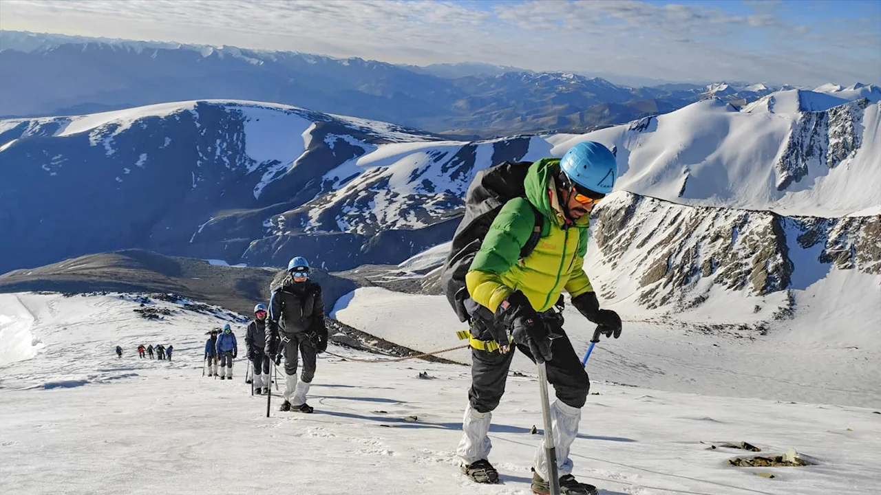 Mountaineers and trekkers climbing a high-altitude Himalayan expedition.