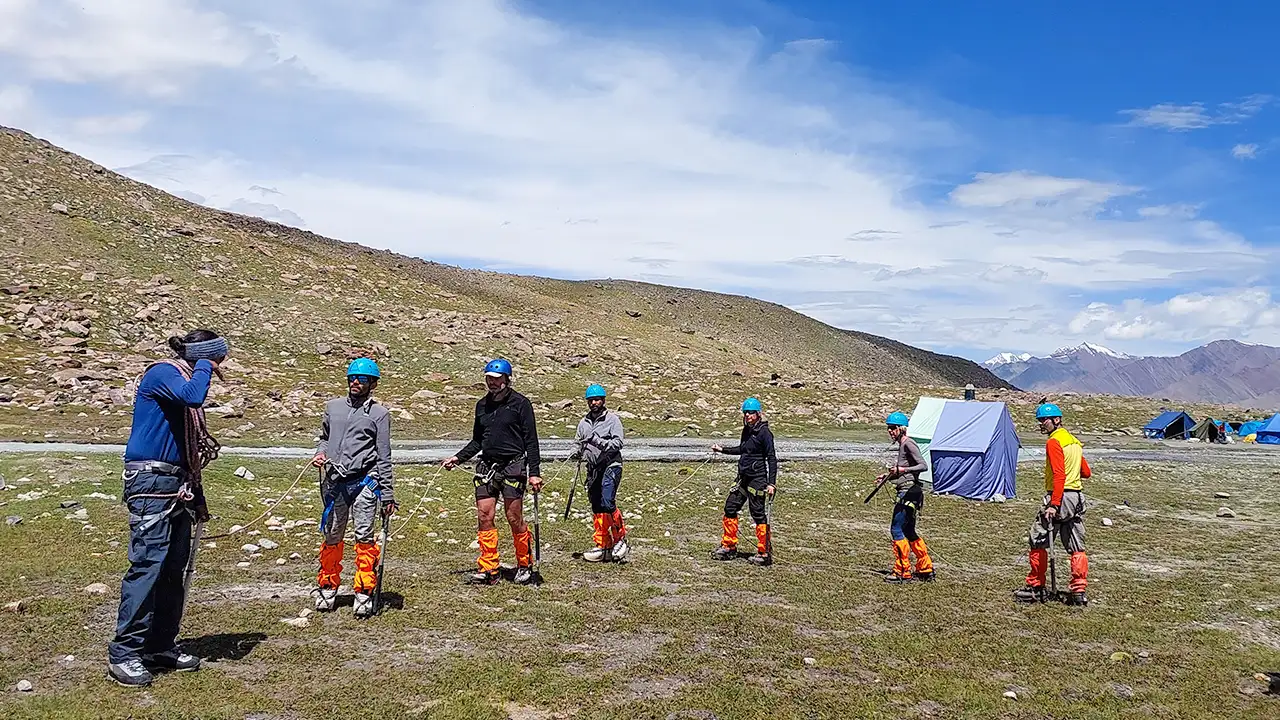 Trekkers acclimatizing at high-altitude base camp during mountain expedition, Trek The Himalayas