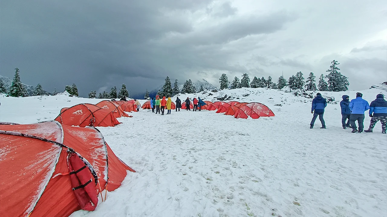Campsite of Trek The Himalays at Khullara Top covered in snow