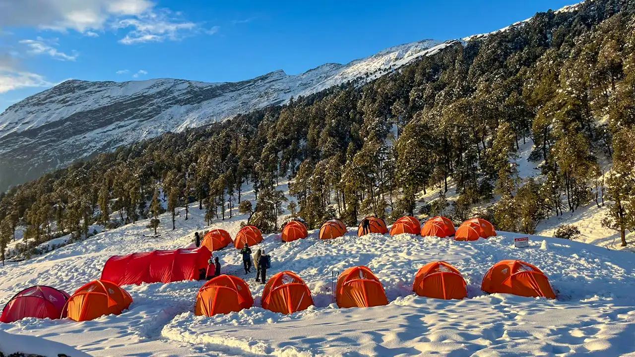 Camping tents of trek the himalayas on snow-covered mountain landscape in winter