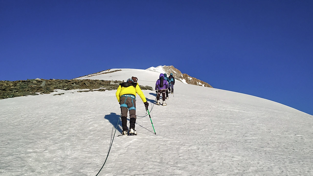 Trekkers climbing on moderate to difficult expedition route.